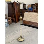 An early 20th century brass telescopic three light lamp standard