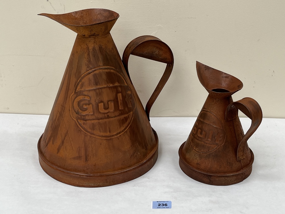 Two metal 'Gulf' oil jugs of recent manufacture. The larger jug 12½' high