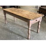 A Victorian and later pine farmhouse table, the scrubbed pine plank top over a frieze drawer on