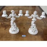 A pair of 19th century white glazed two light amorino candelabra. 11' high