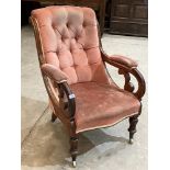 A Victorian walnut and upholstered armchair with deep buttoned back on inverted baluster turned