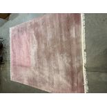 A Chinese pink ground wool carpet. 108' x 144' approx.