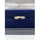 A five stone diamond wedding ring. In white gold. 4g gross. Size N (Engraved)