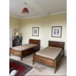 A pair of early 20th century 3'4' mahogany bedsteads with bases and mattresses