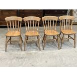 A set of four beechwood lath-back kitchen chairs