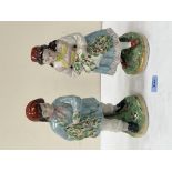 A pair of 19th century Staffordshire figures, rustic boy and female companion. 11½' high