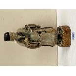 A Sancai style glazed earthenware figure of an official. 14' high. Damage, repairs