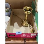 A brass student's candle lamp with a brass candle snuffer