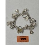 A silver charm bracelet with locket clasp. 2ozs 2dwts.