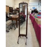 A mahogany cheval dressing mirror