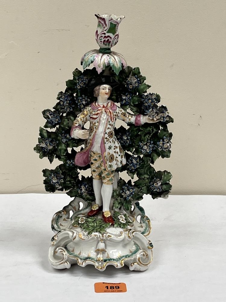 An 18th centure Chelsea Derby figural and bocage candlestick. 12' high