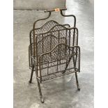 A Victorian gilt tubular brass and wire mesh four division newspaper rack. 28½' high.