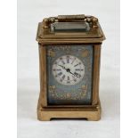 A late 19th century French gilt brass miniature carriage timepiece, the dial sides and back with