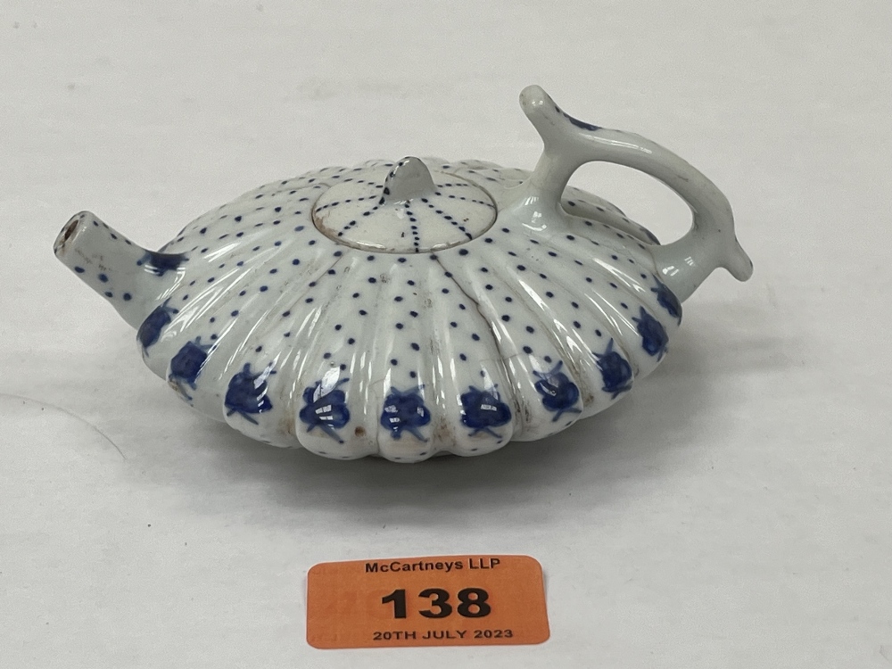 A Chinese blue and white decorated teapot and cover of lobed compressed globular form. Six figure