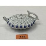 A Chinese blue and white decorated teapot and cover of lobed compressed globular form. Six figure
