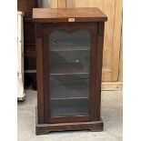 A Victorian mahogany music cabinet enclosed by a glazed door. 35½' high