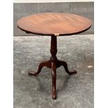 A 19th century mahogany tripod table, the one piece snap top on tapered column with wrythen knop.