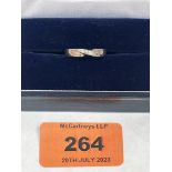 A five stone diamond weddng ring. In white gold marked 750. 4g gross. Size N (Engraved)