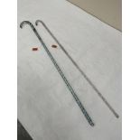 Two 19th century glass 'frigger' walking canes. 35' long. The coloured example repaired