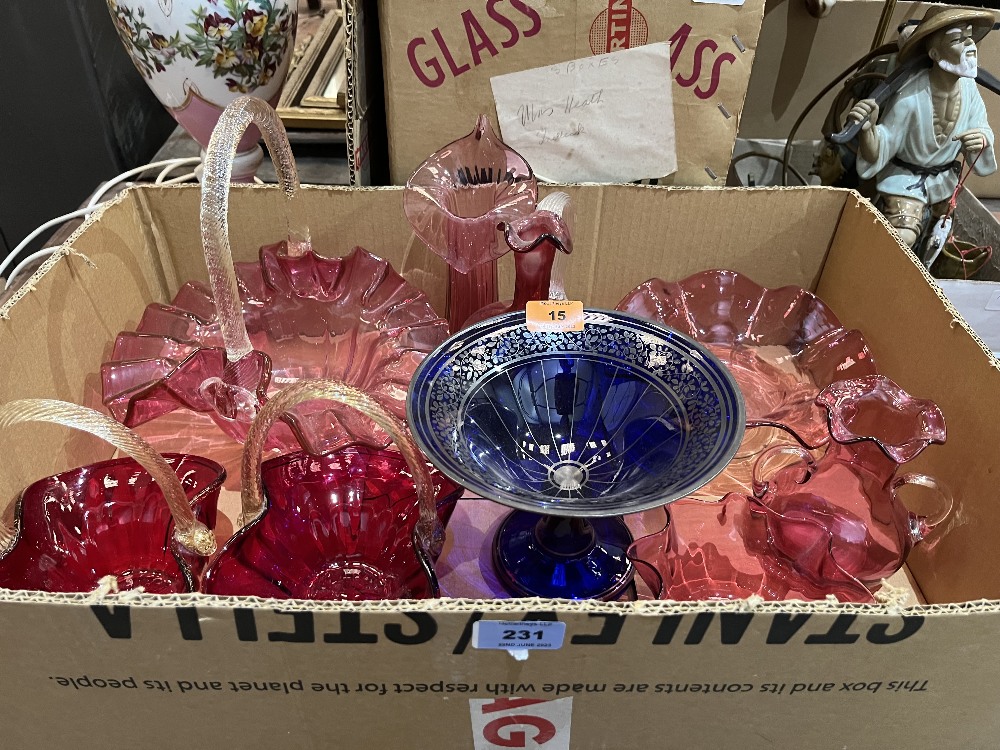 Eight items of cranberry glass and a blue glass comport