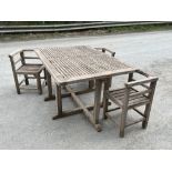 AMBROSE HEAL. A joined teak garden table and three chairs designed in 1939. The table 54' x 36'