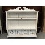 A Victorian set of painted wall shelves with four inset ceramic tiles. 36' wide