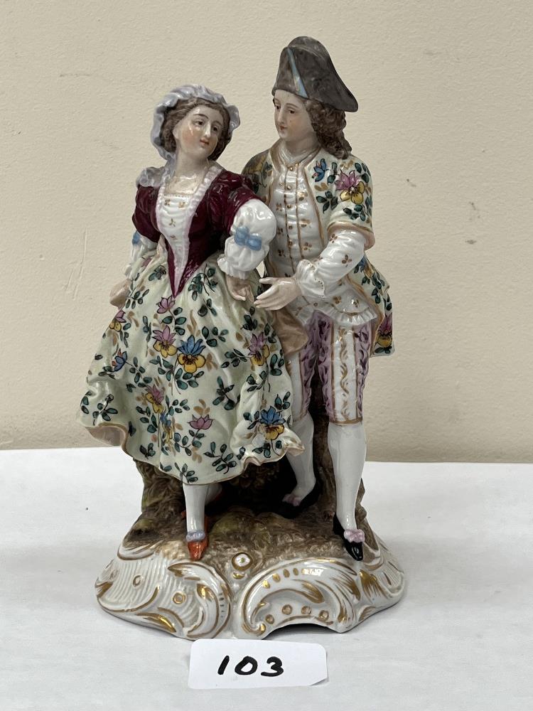 A 19th century German porcelain group of two lovers in gaily painted attire. Indistinct mark in