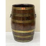 An oak and brass coopered barrel. 19' high