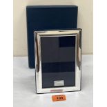 An Elizabeth II silver photograph frame. 7' high. As new, boxed.