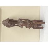 A Senufo Tribal carved wood maternity figure. 26' high