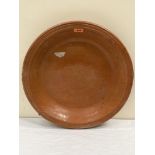 A glazed earthenware bowl. 19½' diam.