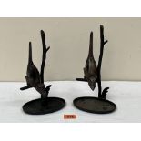 A pair of bronzed metal birds on branch sculptures. 10' high