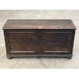 An oak boarded chest with geometrically moulded front. 36' wide