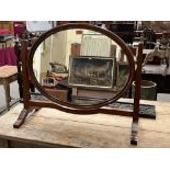 An early 20th century mahogany dressing mirror with oval plate. 29' wide