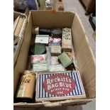 A box of vintage packets and tins