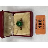 A jade cabochon ring. In gold marked 375. 4g gross. Hoop broken