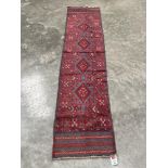 A Meshwani carpet runner. 2.43m x 0.53m