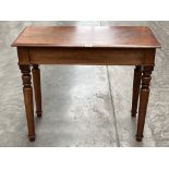A Victorian mahogany side table with frieze drawer on turned tapered legs. 33' wide