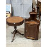 A mahogany drum occasional table and an oak hanging corner cupboard