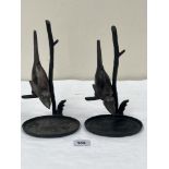 A pair of bronzed metal birds on branch sculptures. 10' high