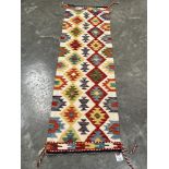 A Chobi Kilim runner. 1.96m x 0.62m