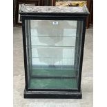 An ebonised display case with side door. 31'h x 20'w