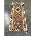 A Chobi Kilim runner. 1.55m x 0.62m