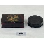 A 19th century carved ebony snuffbox and a 19th century papier-mache stamp box, 3¾' wide