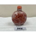A Chinese porcelain snuff bottle with hardstone stopper. 2¾' high