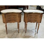 A pair of kidney shaped chests of three drawers in the French manner, with brass galleried marble