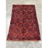 A Baluchi rug. 1.36m x 0.84m