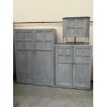 A painted oak wardrobe by Heals, enclosed by two pairs of panel doors, 89' wide x 69' high; together