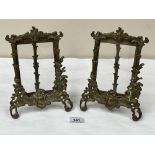 A pair of brass rococo revival strut photograph frames. 9' high