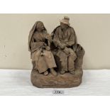 An Italian terracotta group of a cobbler and wife. 9' high